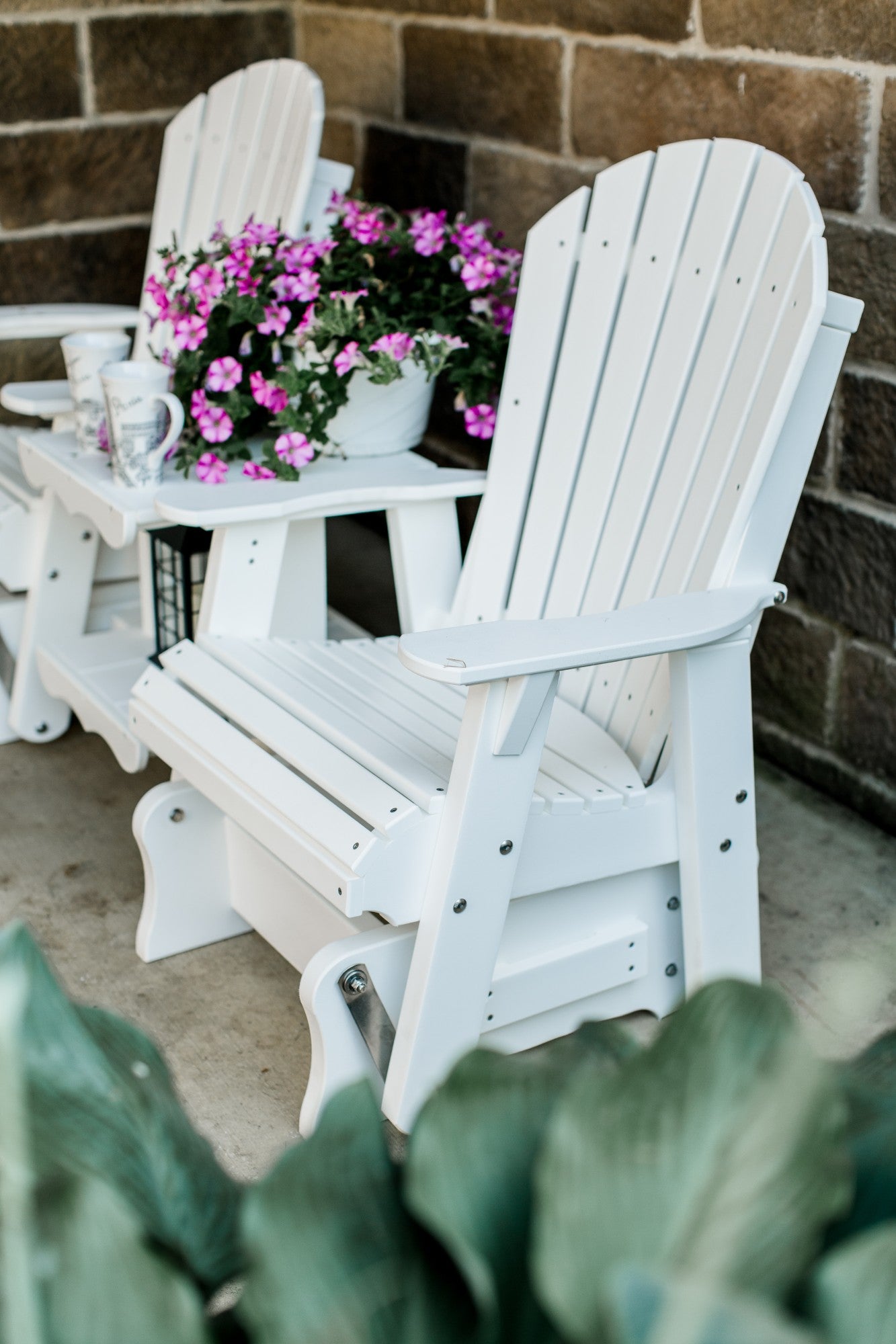 white patio glider set with table