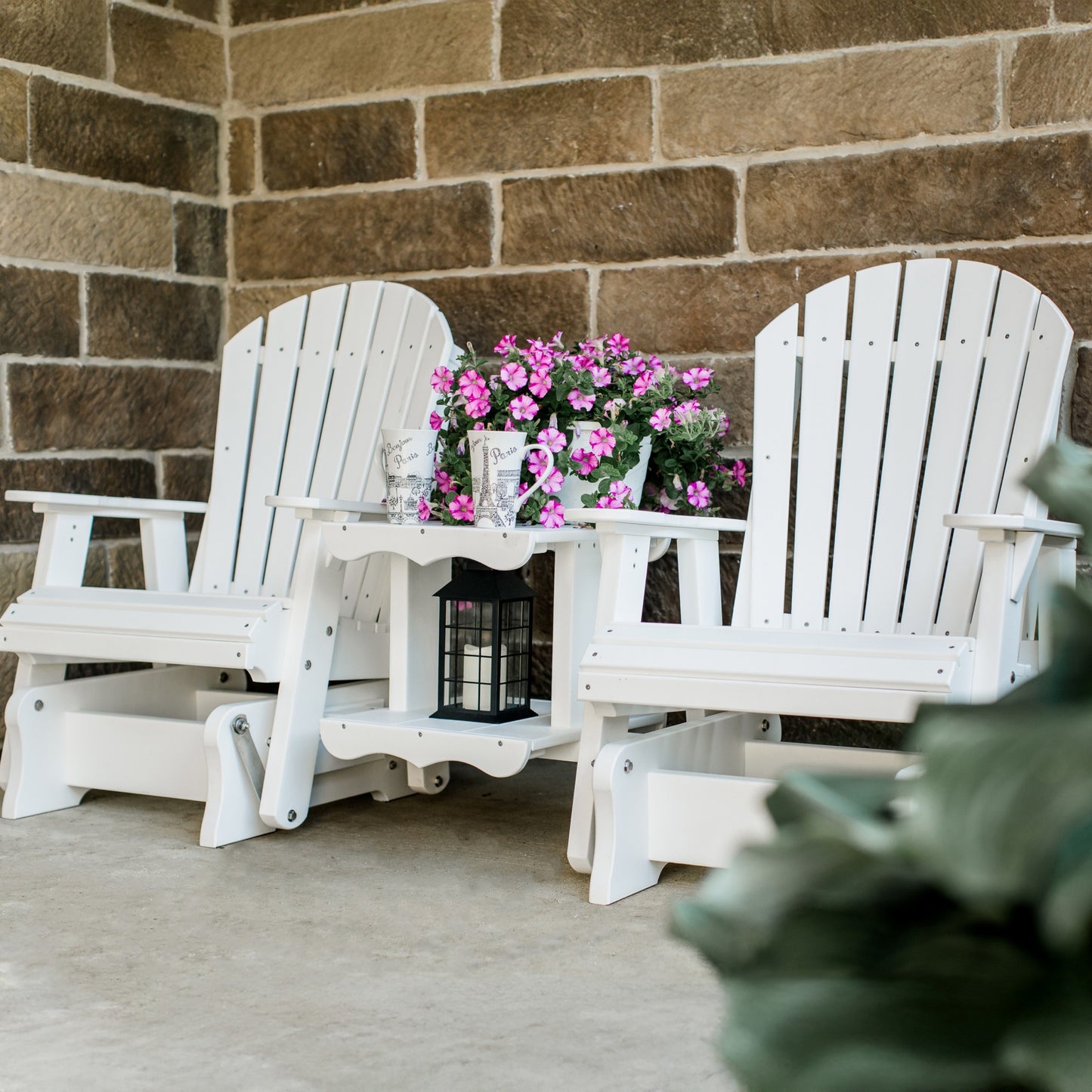 white patio glider set with table