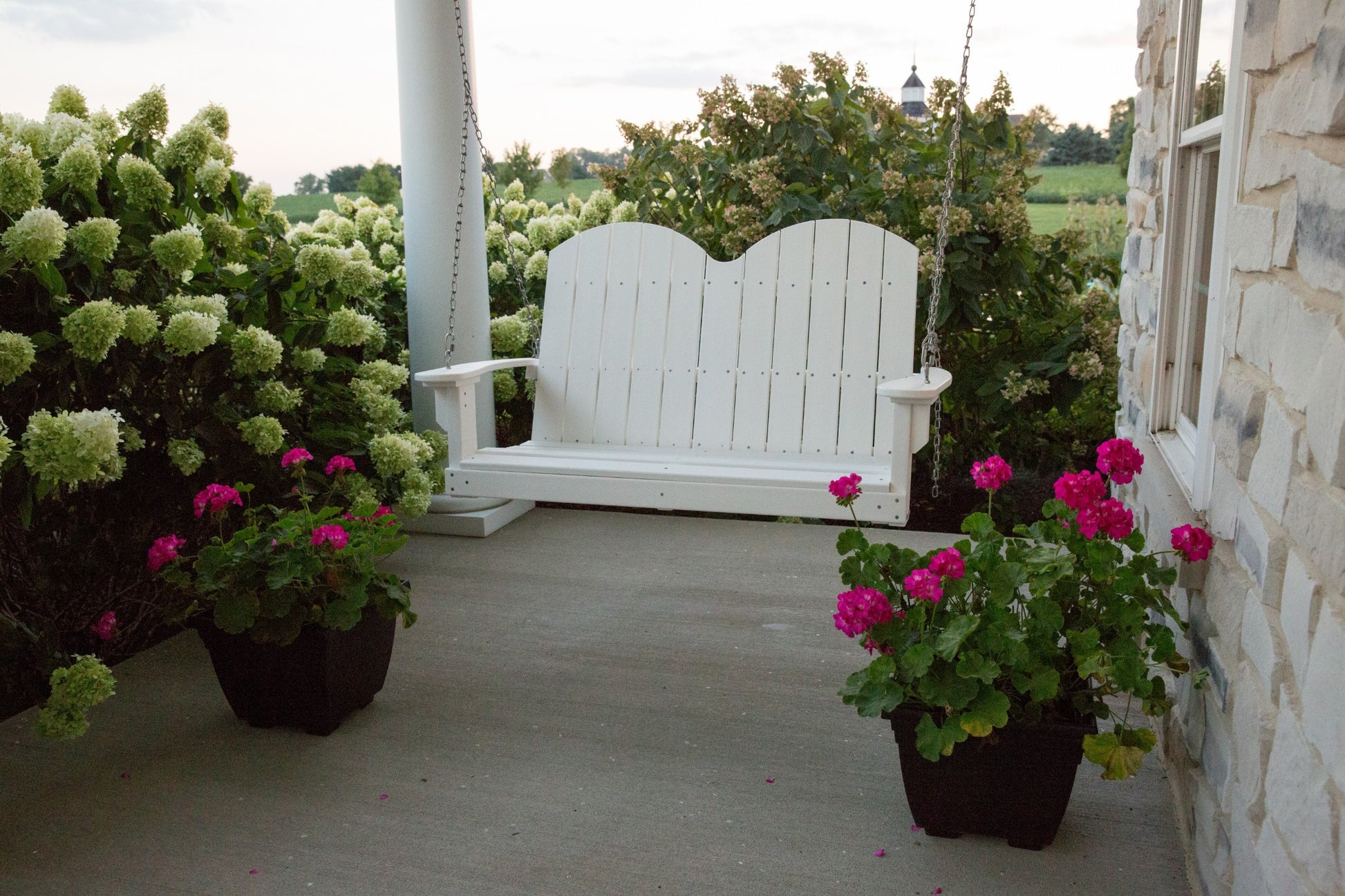 white porch swing outdoors